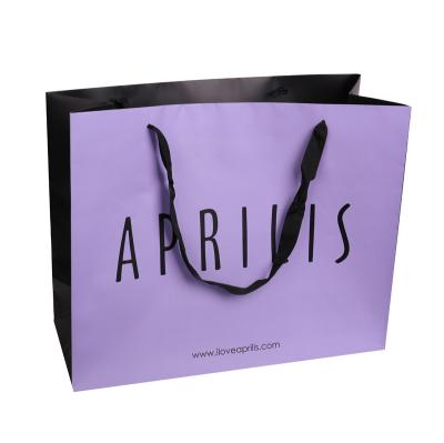 China Purple Disposable Black Printed Paper Bag With Handle Luxury Paper Bag for sale