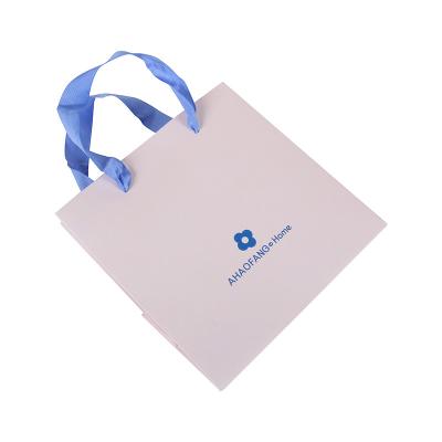 China Disposable Pink Paper Bag With Handles And Logo Printing Blue Gift Paper Bag for sale