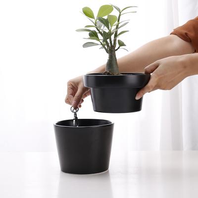 China Europe Stylish Matte Black Glazed High Quality V Shaped Set Of 2 Ceramic Planter Pots for sale