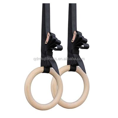 China Durable Wholesale Fitness Exercise Gym Rings Nylon Cross Strap Fitness Wooden Exercising Gymnastic Rings for sale