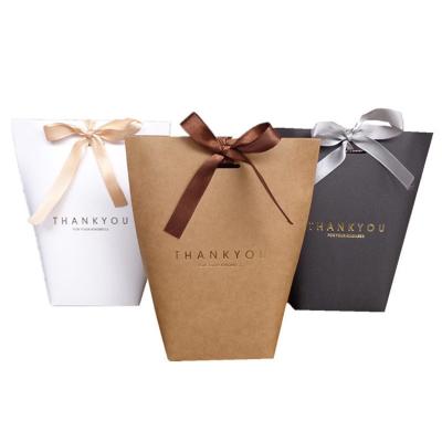 China Recycled Materials China Manufacturer Fashionable Luxury Decorative Gift Paper Bags With Ribbon Handles for sale