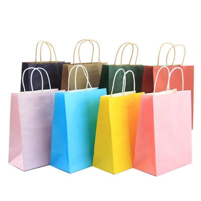 China Recycled materials wholesale fashionable custom logo printed low price direct selling kraft paper shopping bag with brand for sale