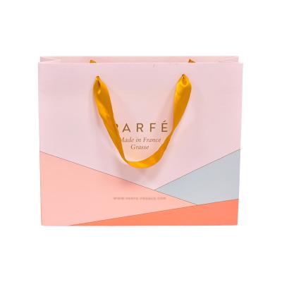 China Luxury New Style Clothing Logo Recyclable Custom Paper Bags Recyclable Gift Bag Shopping Packaging Bag With Handle for sale