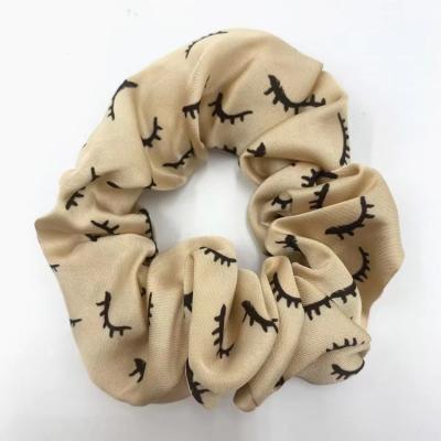 China Women Hair Tying and Decorating Wholesale Eyelash Scrunchie High Quality Women Shape Elastic Bands Eyelash Printing Elastic Hair for sale