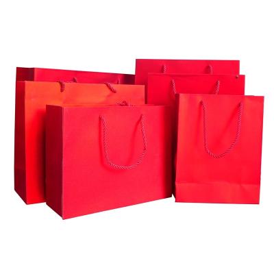 China Materials OEM High Quality Colorful Glitter Paper Craft Recycled Paper Card Shopping Bags with Ribbon Handle for Gift Clothing Shoes Packaging for sale