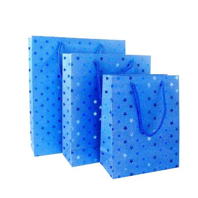 China OEM Recyclable High Quality Colorful Glitter Paper Craft Paper Card Shopping Bags with Ribbon Handle for Gift Clothing Shoes Packaging for sale