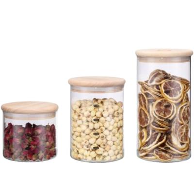 China Who respects the environment; Airtigh Design Keep Food Fresh Airtight Design Around Shape Lid Borosilicate Glass Storage Jar Wooden Food Container for sale