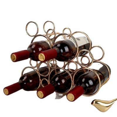 China Durable Wine Storage Display Racks Honeycomb Shape Gold Metal Wine Rack for sale