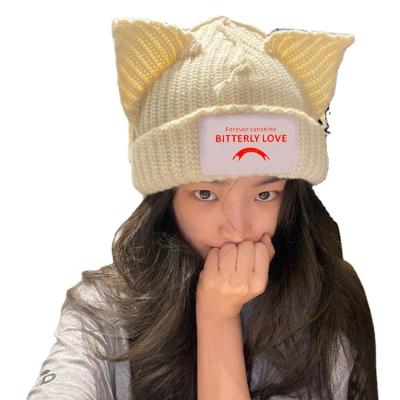 China Beanie Hat Ins Simple Popular Little Devil Striped Cat Ears Pointed Pullover Women's Knitted Hats Cute Autumn And Winter Wool Hat for sale