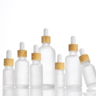 China Personal Care 5ml 10ml 15ml 20ml 30ml 50ml 100ml Essential Oil Clear Frost Glass Bottle With Dropper for sale