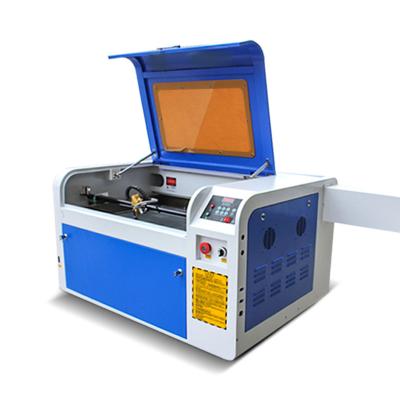 China Interactive system 100w laser tube 4060 laser cnc engraving machine for m2 wood system small acrylic cutting tools carver for sale