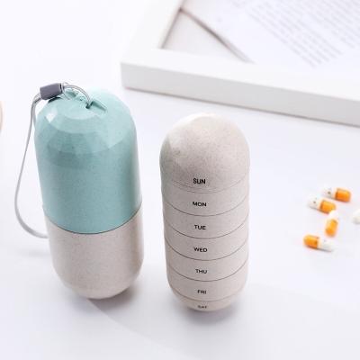 China Portable Pill Box 7 Days Wheat Straw Capsule Shape Portable Pill Box for sale