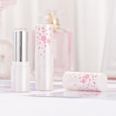 China 3.5g hexagon fashion lipstick packaging cherry blossoms printed white empty round flower lipstick tube for sale