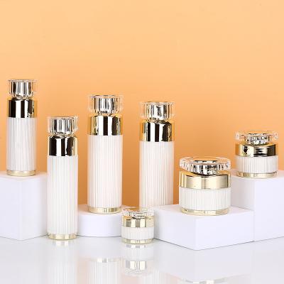 China Skin Care Cosmetic Luxury Acrylic Set Spray Bottle Empty Emulsion Bottle Plastic Champagne Bottle for sale