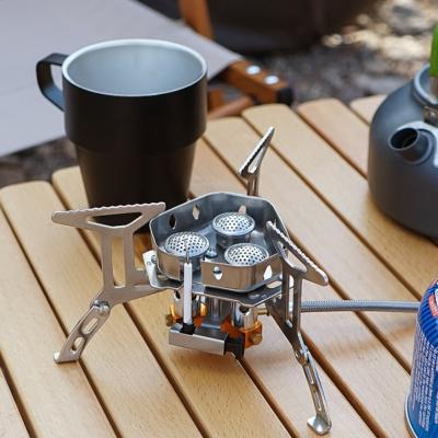 China Windproof Outdoor RV Gas Stove Camping Gas Burner Electronic Stove Heightening Stoves 5800W Portable Split Core Three Head Set Rise for sale