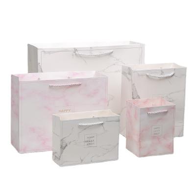 China Custom Design Luxury Recyclable Printed Logo Marble Effect Recycled Paper Gift Bags With Drawstring Handles for sale