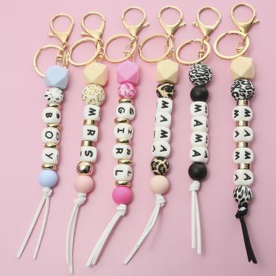 China Faux Fur Ball Pompom Chains 2023 MOM Mothers Day Pendant Gift Customized Wooden Bag Car Silicone Pearl Key Chain Letter Disc for sale