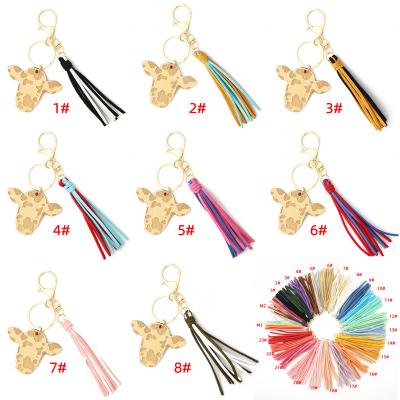 China Faux Fur Ball Pompom Chains New Design Western Cowboy Colorful Suede Tassel Monogram Cow Print Head Wood Pendant Chain for sale