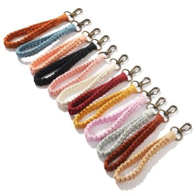 China Faux Fur Ball Pompom Chains Key Chains Handmade Woven Bracelet Bohemia Solid Color Wristband Cotton Yarn Macrame Keychains For Women for sale