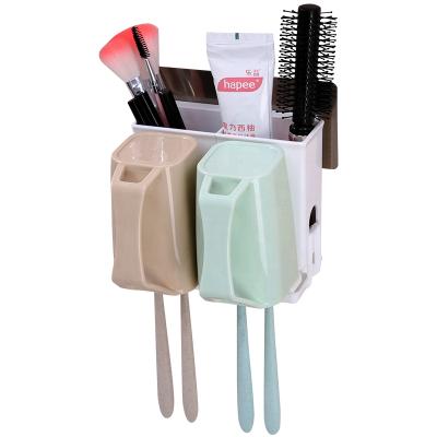 China Modern Multifunctional Wall Mounted Double Toothbrush Cup Toothbrush Holder Plastic For Bathroom Accessories for sale