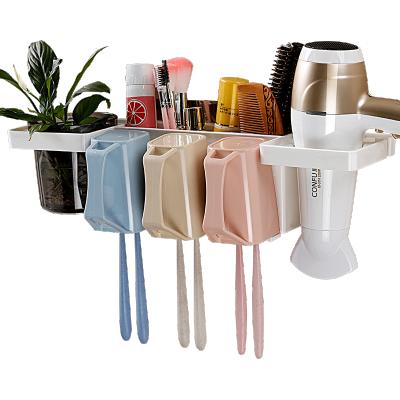 China Multifunctional Eco-friendly Plastic Toothbrush Holder Wall Mounted With 3Cups FamilyToothbrush Holder For Bathroom for sale