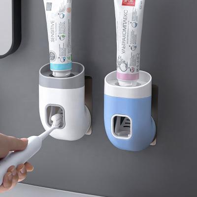 China Stocked Wall Mounted Acrylic Toothpaste Dispenser Toothbrush Holder And Dispenser for sale