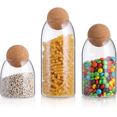 China Freshness Preservation 500ml 800ml Kitchen Candy Clear Jar Mason Jars Food Storage Canister Glass Jar With Airtight Seal Lid Wood Ball for sale