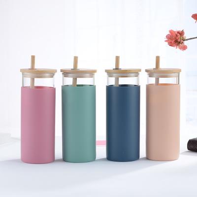 China Modern Custom Logo Heat Resistant High Borosilicate Wide Mouth Glass Water Bottle With Silicone Bamboo Lid And Straw Sleeves for sale