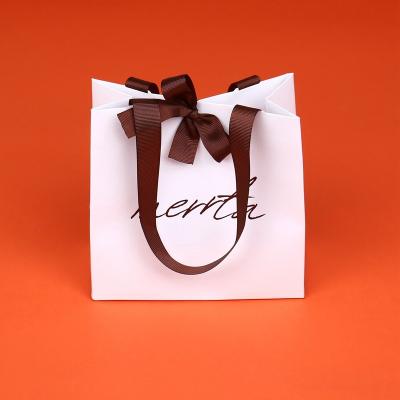 China Recyclable Customized Debossed Embossed Sturdy Logo Customized Special High Quality Eco Friendly Paper Bag Ribbon for sale