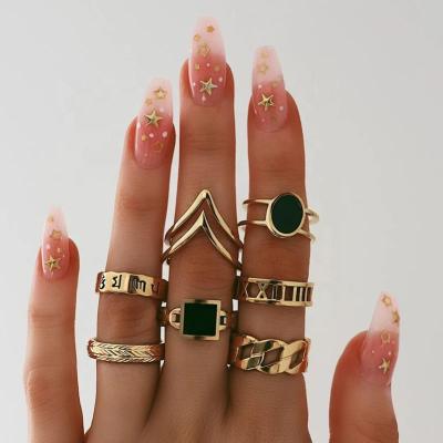 China 7Pcs/set Women Gold Color TRENDY Vintage Midi Rings Black Rhinestone Letter Finger Ring Set for sale