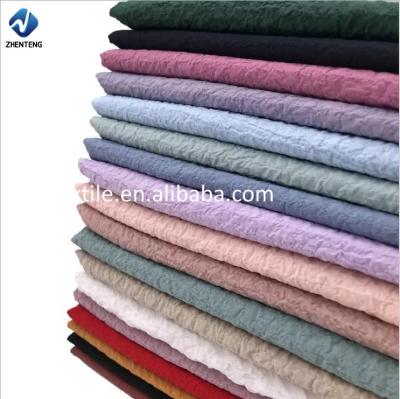 China Multiple colors high quality hot sale waterproof running fabric polyester crepe chiffon bubble cloth pajamas fabric for home textile for sale