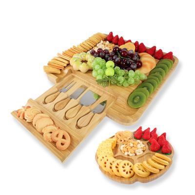 China Sustainable Unique Bamboo Cheese Board Charcuterie Tray Serving Tray With 4 Stainless Steel Knife for sale