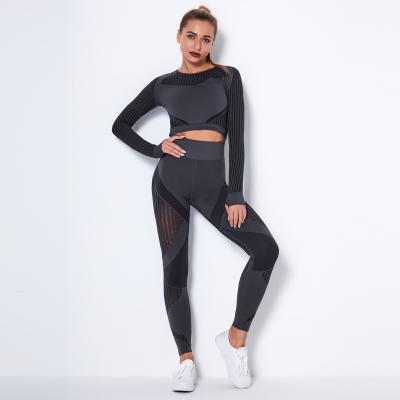 China Breathable Women's Hollow Sportswear Set Mesh Yoga Top and Seamless Quick Dry Leggings 2 Pieces Sports Suit for sale