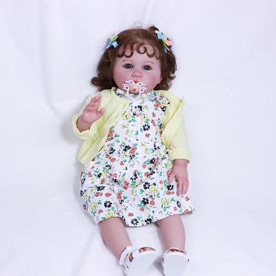 China Toy Wholesale 60cm Soft Realistic Painted Baby Dolls Cute Reborn Girl With Curly Hair for sale