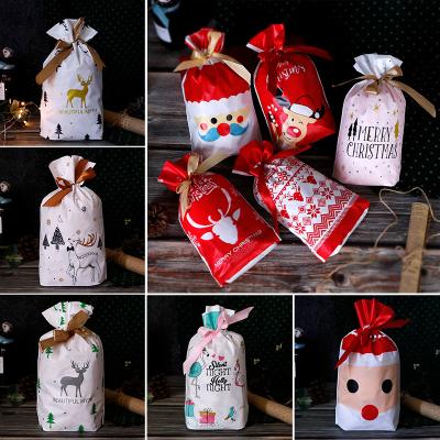 China ZIXU 50pcs Recyclable Christmas Treat Goodies Plastic Drawstring Gift Bags for sale