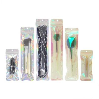 China Pouch Moisture Proof Resealable Transparent Hologram Makeup Brush Laser Zipper Clear Plastic Packaging Bag for sale