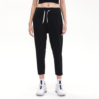 China 2021 High Quality Breathable Women Sports Wear Pocket Sweatpants Breathable Elastic String Women Joggers for sale