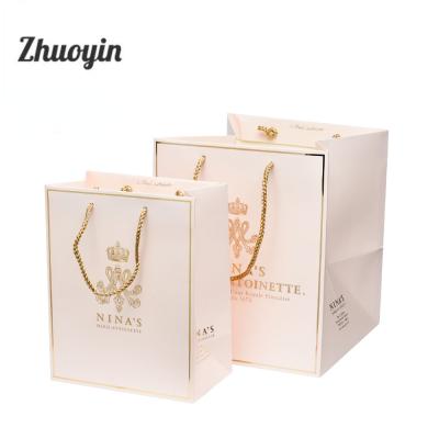 China Recyclable Custom Lightweight Screen Printing Gold Foil Stamping Paper Gift Packaging Bags With Your Own Logo for sale