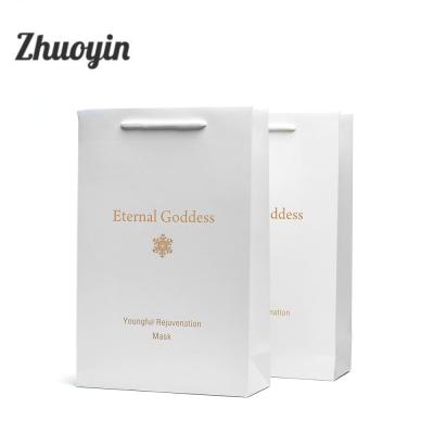 China Customized Luxury White Foldable Recyclable Tote Paper Shopping Bag With Logo for sale