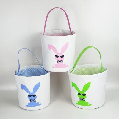 China 2021 Wholesale Kids Canvas Fabric Funny Easter Bunny Baskets With Handle Easter Egg Rabbit Basket for sale