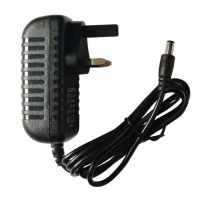 China Premier UK 12v 1a 5v 1a 5v 2a 6w 12v 0.5a Switching Electronic Products UK AC DC Power Supply Adapter for sale