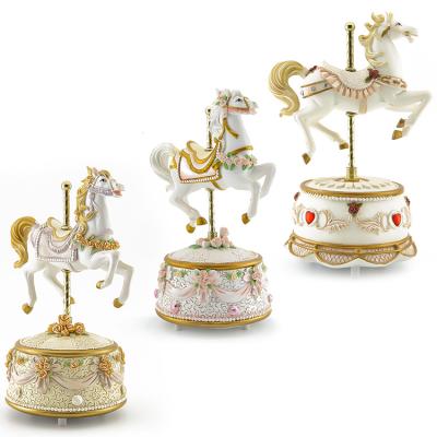 China Stylish Polyresin OEM ODM Music Box Baby Horse Carousel Christmas Figurines For Wedding Gifts for sale