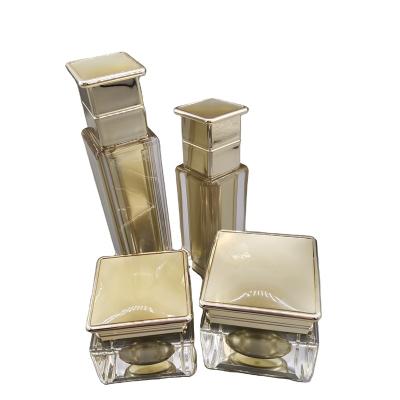 China Cosmetic Cosmetic Packaging Square Acrylic Plastic Squares Cosmetic Bottles And Jars Set for sale