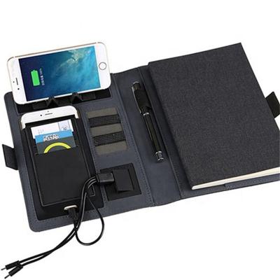 China 8000mah Multifunction wireless charger notebook power bank with phone holder for sale