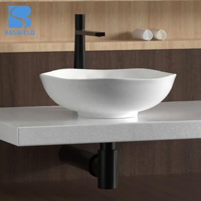 China Modern Over Counter White Ceramic Designer Basin Hand Wash Bathroom Sink for sale