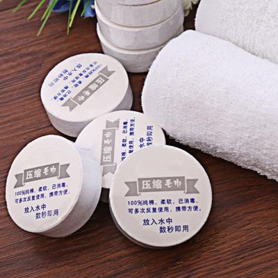 China Mini Travel Hotel Towel Outdoor Portable Compressed Cotton Towel Solid Color Disposable Towel for sale