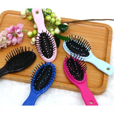 China Lovely Compact Professional Plastic Mini Kid's Hair Brush For Kids Baby Hair Combs With Massage Function for sale