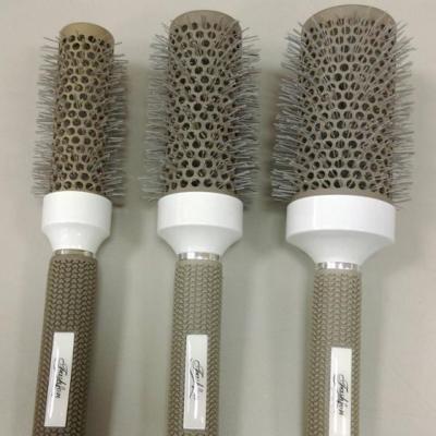 China Care Professional Ceramic Cylinder Cushion Hair Salon Hair Detangler Hair Brush Comb Rolling Wholesale for sale