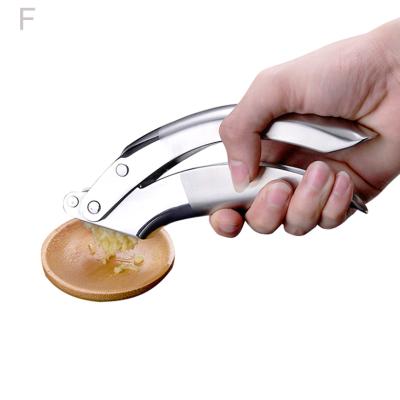 China Manual Operation Sustainable Professional Twist Garlic Press Vegetable Tools for sale