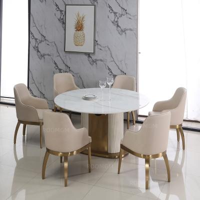 China Extendable oval to round agglomerated stone brushed gold dining tables and low chairs for sale